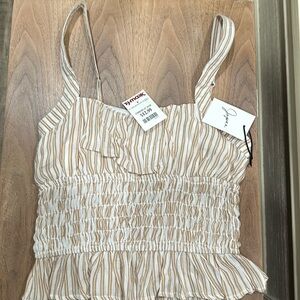 Japna, tan and white striped peplum top.